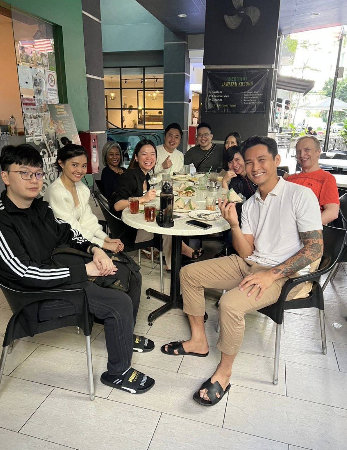 Andreas, Najwa, and participants at the pre-training breakfast at a mamak nearby