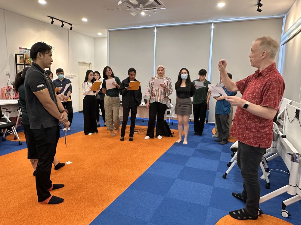 Andreas Dorn leading a corporate group exercise